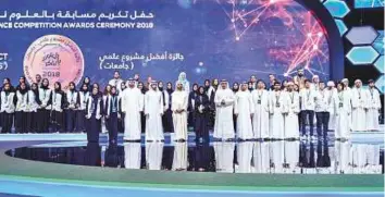  ??  ?? Shaikh Mohammad with the winners of the Think Science contest during the awards ceremony held at the Dubai World Trade Centre yesterday. WAM