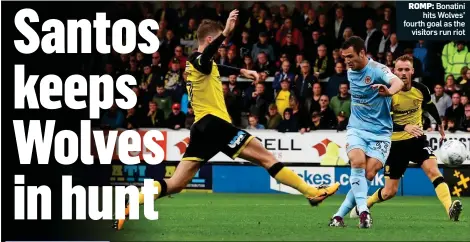  ??  ?? ROMP: Bonatini hits Wolves’ fourth goal as the visitors run riot