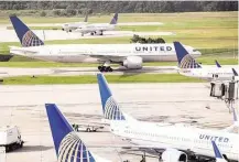  ?? Brett Coomer / Houston Chronicle ?? The crowd of United Airlines planes at George Bush Interconti­nental Airport will get smaller, the airline says.