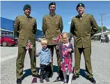  ??  ?? Lance corporal Carson Paiere, Private Hamish Webster and his children Sam, 3, and Isabelle, 4, and private Andrew Gerritsen, of Invercargi­ll, at the Tapanui Armistice Day parade.