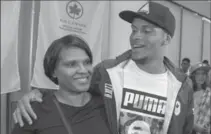  ?? CANADIAN PRESS FILE PHOTO ?? Twenty-two-year-old Markham, Ont., runner Andre De Grasse hugs his mother, Beverley, as he arrives in Toronto in August.