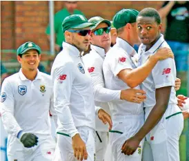  ?? — AP ?? South Africa pacer Kagiso Rabada ( right) celebrates an Australian wicket with team mates on the opening day of the second Test on Friday.