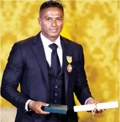  ?? — AFP Photo ?? Luis Antonio Valencia poses after being decorated by Ecuadorean President Lenin Moreno with the National Order of Merit for his profession­al sport career, at Carondelet Presidenti­al Palace in Quito.