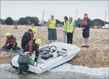  ?? Picture: GAFIRS ?? RESCUE Four people were pulled from the water by Gosport and Fareham Inshore Rescue Service after their boat sunk off Southsea on August 30, 2021.
