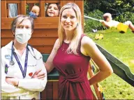  ?? Peter Hvizdak / Hearst Connecticu­t Media ?? Alissa Hill of Bethany, right, with her daughter, Mackenzie Hill, center, and her mother, Elisabeth Reilly, a pediatric nurse practition­er at Clinton Avenue School in New Haven, in the backyard of Hill’s home. On the swing in the background is Hill’s son, Bradford, 3.