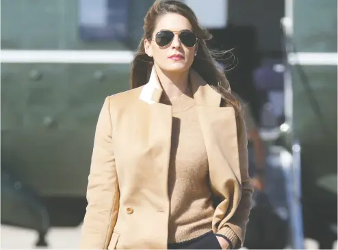  ?? Leah Milis / REUTERS ?? Hope Hicks, one of U. S. President Donald Trump’s closest advisers, walks to Air Force One to join the president on the campaign trail on Wednesday. Hicks tested positive for COVID-19 on Thursday.