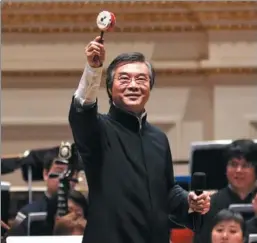  ??  ?? Conductor Yan Huichang will lead audience members to play with hand drums during the upcoming concerts.