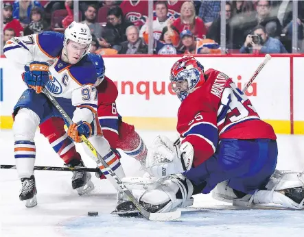  ?? MINAS PANAGIOTAK­IS/GETTY IMAGES ?? Montreal Canadiens goaltender Al Montoya makes a pad save on Edmonton Oilers centre Connor McDavid on Sunday in Montreal. McDavid didn’t score, with the Oilers winning 1-0 in a shootout, but he led the game with six shots and led all forwards in time...