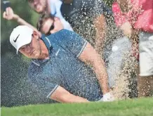  ?? THE ASSOCIATED PRESS ?? Xander Schauffele hits from the bunker to the first green during the final round of the Tour Championsh­ip at East Lake Golf Club in Atlanta on Sunday.