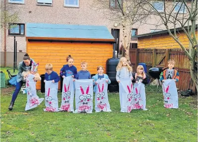  ?? ?? Bunny hops A sack race at Crieff Community Garden