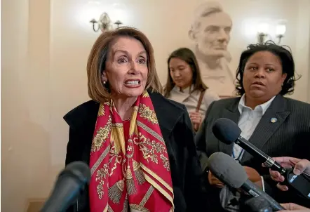  ?? AP ?? Speaker of the House Nancy Pelosi, D-Calif., responds to reporters after officially postponing President Donald Trump’s State of the Union address until the government is fully reopened.