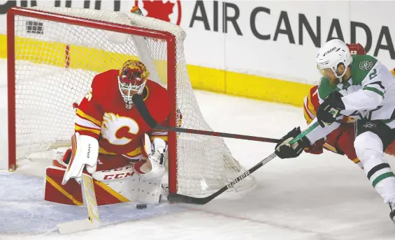  ?? DARREN MAKOWICHUK ?? Flames goalie Jacob Markstrom stops a shot from the Dallas Stars' Jani Hakanpaa during Game 5 of their first-round playoff series on Wednesday at the Saddledome.