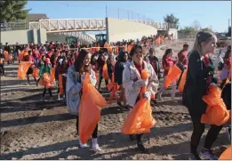  ?? Courtesy photo ?? Canyon High School students gather for the River Rally cleanup in 2017.