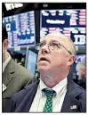  ?? AP/RICHARD DREW ?? Trader Frederick Reimer keeps watch Tuesday on the floor of the New York Stock Exchange as prices seesaw.