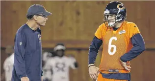  ?? | NAM Y. HUH/AP ?? Cutler talks with coach Marc Trestman during minicamp last month in Lake Forest.