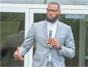  ?? PHIL LONG/AP ?? LeBron James speaks at the opening ceremony for the I Promise School in Akron, Ohio, on July 30.