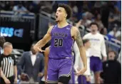  ?? CHRIS O’MEARA — THE ASSOCIATED PRESS ?? Furman forward Jalen Slawson (20) reacts after making a 3-pointer against Virginia during the second half of a first-round game in the NCAA Tournament on Thursday in Orlando, Fla. Furman beat Virginia 68-67.