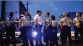  ?? MATT ROURKE ?? Officers gather for crowd control near a massive police presence set up outside a house as they investigat­e a shooting in Philadelph­ia, Wednesday, Aug. 14, 2019.