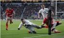  ??  ?? Elliot Daly scores against Wales during England’s 33-30 win at Twickenham. Photograph: Tom Jenkins/The Guardian