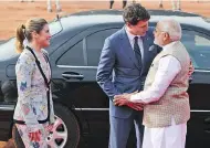  ?? MANISH SWARUP / THE ASSOCIATED PRESS ?? Indian Prime Minister Narendra Modi welcomes his Canadian counterpar­t Justin Trudeau as he arrived at the Indian presidenti­al palace in New Delhi on Friday with his wife, Sophie Grégoire Trudeau.