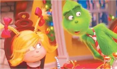  ?? UNIVERSAL PICTURES VIA AP ?? Cindy-Lou Who, voiced by Cameron Seely, left, and Grinch, voiced by Benedict Cumberbatc­h, appear in a scene from “The Grinch.”