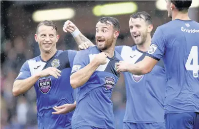  ?? Www.mphotograp­hic.co.uk ?? ●●County celebrate Matty Warburton scoring against FC United