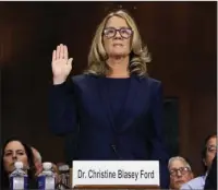  ?? The Associated Press ?? UNDER OATH: Christine Blasey Ford is sworn in before testifying to the Senate Judiciary Committee on Thursday in Washington.