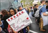  ?? AP ?? Tyra Hemans and other Marjory Stoneman Douglas High School students prepare to board buses bound for Florida’s Capitol to press for gun laws.