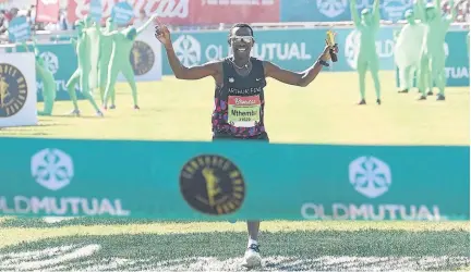  ?? / ANESH DEBIKY / GALLO IMAGES ?? Bong’musa Mthembu clinches victory at the 93rd edition of the Comrades Marathon - his second so far in three years. He dedicated the triumph to his son Sisanda.