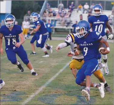  ?? Terrance Armstard/News-Times ?? Turn the corner: Parkers Chapel's Ryan Simpson (9) looks for an opening during the Trojans' contest against Mayflower earlier this season at Parkers Chapel. Tonight, the Trojans host Fordyce in an 8-2A showdown in their first home game in nearly a month. Game time is set for 7 p.m.