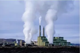  ?? (AP Photo/Rick Bowmer/File) ?? Steam billows from a coal-fired power plant on Nov. 18, 2021, in Craig, Colo. The U.S. Securities and Exchange Commission on Wednesday approved a rule that will require some public companies to report their greenhouse gas emissions and other climate risks.