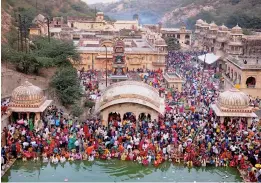  ?? — PTI ?? Devotees offer prayers on the occasion of Chhath Puja at ‘Galta Ji’ in Jaipur on Friday.