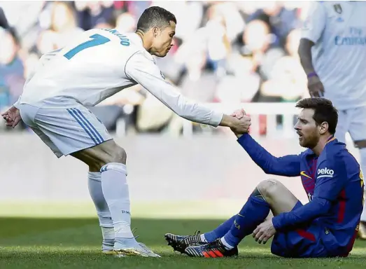  ?? — AP ?? He’s coming for you: Real Madrid’s Cristiano Ronaldo (left) is making a strong run to snag the scoring title from Barcelona’s Lionel Messi.