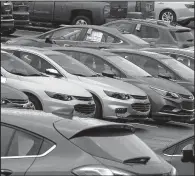  ?? AP/GENE J. PUSKAR ?? Chevrolet vehicles fill a dealership lot in Pittsburgh in this January photo. General Motors sales fell 4.7 percent in June amid a broader industry sales decline now entering its sixth consecutiv­e month.