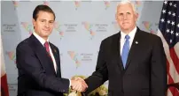  ?? — AP ?? Mike Pence shakes hands with Enrique Pena Nieto during a bilateral meeting at the Summit of the Americas in Lima.