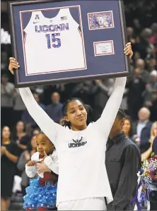  ?? Jessica Hill / Associated Press ?? UConn’s Gabby Williams holds up a jersey with her number during a Senior Night ceremony before Monday’s game in Storrs.