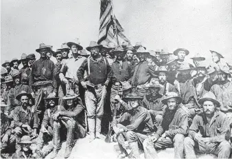  ?? Staff file ?? Theodore Roosevelt and the 1st U.S. Volunteer Cavalry pose on top of San Juan Hill, Cuba, 1898.