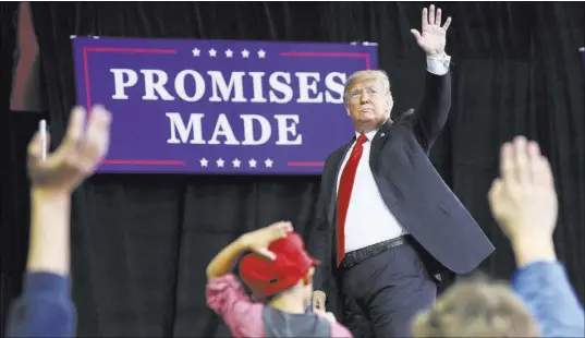  ?? Pablo Martinez Monsivais The Associated Press ?? President Donald Trump waves to supporters after speaking Saturday at a campaign rally in Topeka, Kan.