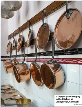  ?? gesine garz ?? > Copper pans hanging in the Kitchen at Lanhydrock, Cornwall