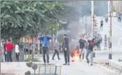  ?? REUTERS FILE ?? Kashmiris throw stones on security forces during curbs after the scrapping of the special status for J&K on August 10.