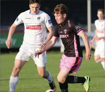  ??  ?? Vincent Quinlan of Wexford F.C. taking on Luca Lovic of U.C.D. in Tuesday’s encounter.