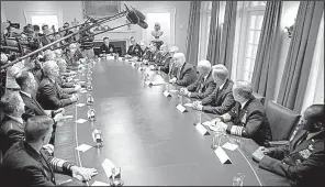  ?? The New York Times/DOUG MILLS ?? President Donald Trump meets with senior military leaders Thursday in the Cabinet Room at the White House. Trump and senior security advisers have agreed to “decertify” the nuclear agreement with Iran, sources said Thursday, the first step toward possible renewed sanctions.