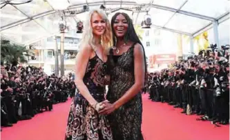  ?? — AFP photos ?? Australian actress Nicole Kidman (left) and British model Naomi Campbell pose as they arrive for the ‘70th Anniversar­y’ ceremony of the Cannes Film Festival in Cannes, southern France.