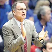  ?? [AP PHOTO] ?? Oklahoma head coach Lon Kruger tries to energize his team during the first half of Monday’s game against Kansas in Lawrence, Kan.