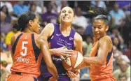  ?? Sean D. Elliot / Associated Press ?? The Connecticu­t Sun’s Jasmine Thomas, left, and Alyssa Thomas, seen defending against former UConn star Diana Taurasi during a 2018 game.