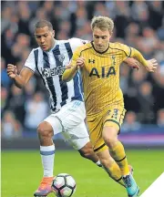  ??  ?? ■ Spurs’ Christian Eriksen eases past West Brom’s Salomon Rondon.