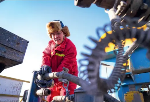  ??  ?? A worker on a drilling platform at Daqing Oilfield in Heilongjia­ng Province, northeast China, on January 8