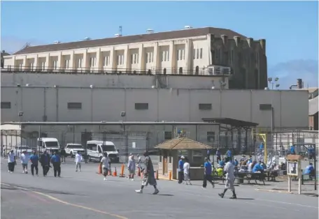  ?? PAUL KITAGAKI JR./THE SACRAMENTO BEE/TNS ?? Inmates exercise outside in the yard at San Quentin State Prison in San Rafael in July. Gov. Gavin Newsom announced a plan to transform the prison into the San Quentin Rehabilita­tion Center. The transforma­tion is being guided by a team of correction­al, reentry and rehabilita­tion experts.