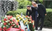  ?? — AFP ?? Turkish foreign minister Mevlut Cavusoglu ( second from left) and German foreign minister Heiko Maas ( left) at a memorial in Solingen on Tuesday.