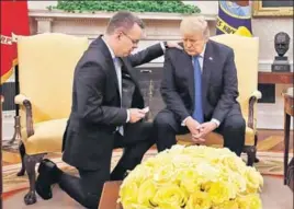  ??  ?? US President Donald Trump prays with American pastor Andrew Brunson at the White House on Saturday. Brunson returned to the US after he was freed after two years of detention in Turkey.